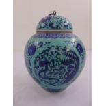 A Chinese ginger jar with pull off cover green glazed decorated with flowers, leaves and scrolls,