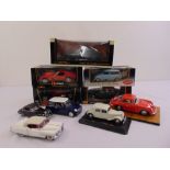 A quantity of 1:18 diecast to include Burago, Maisto, Kyosho and Auto Art Steve McQueen as