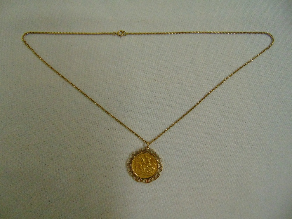 1912 sovereign set in a 9ct gold pendant on a 9ct gold chain, approx total weight 15.0g