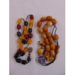Two varying coloured amber bead necklaces