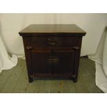 An oriental rectangular plain lacquered chest with hinged cover, two carrying handles and a bronze