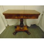 A late Victorian rectangular walnut and mahogany games table on quatrefoil base with claw feet