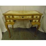 A Florentine dressing table of rectangular form with five drawers and cabriole legs