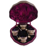 A cased set of Victorian silver salts, octagonal part fluted with ribbons and swags with