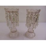A pair of Victorian crystal lustres with pendant drops on raised circular bases