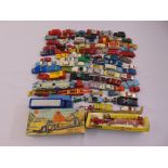 A quantity of diecast to include a boxed set and playworn cars and trucks