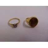 A 9ct gold solitaire diamond ring and a 9ct gold and tigers eye signet ring, approx total weight 4.