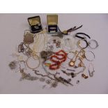 A quantity of costume jewellery to include brooches, necklaces, rings and bracelets