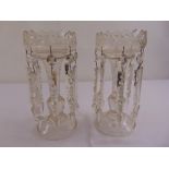 A pair of Victorian cut glass lustres on raised circular bases