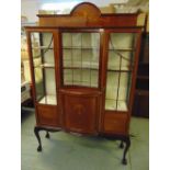 An Edwardian shaped rectangular inlaid mahogany glazed display cabinet on four cabriole legs