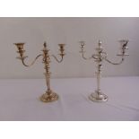 A pair of Garrard silver plated two light candelabra, tapering cylindrical on raised circular