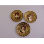 Three Vienna hand painted cabinet plates with aristocratic ladies in full costume to the centre,