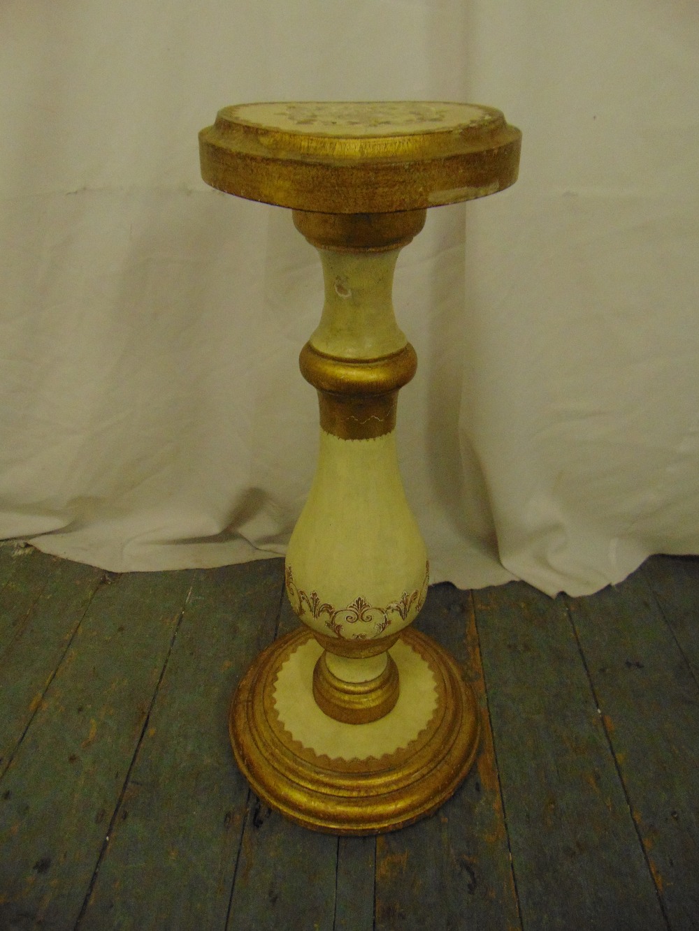 A Florentine pedestal of baluster form with circular top on raised circular base