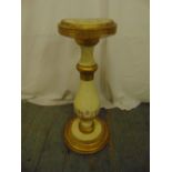 A Florentine pedestal of baluster form with circular top on raised circular base