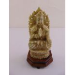 A carved jadeite figurine of Guanjing on raised hardwood base