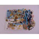 A quantity of costume jewellery to include necklaces, brooches, rings and bracelets