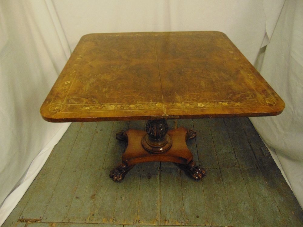 A late Victorian rectangular walnut and mahogany games table on quatrefoil base with claw feet - Image 2 of 2