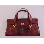 A ladies crocodile skin rectangular handbag