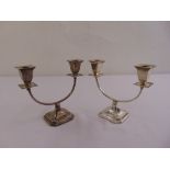 A pair of silver two light candelabra on raised octagonal bases, Birmingham 1936