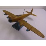 A WWII wooden model of a Lancaster bomber on rectangular plinth A/F