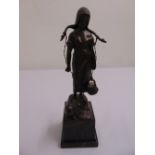 A bronze figurine of a milk maid on raised marble plinth