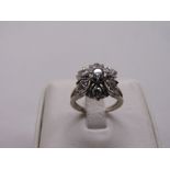 A white gold and diamond cluster ring, gold tested 18ct, approx total weight 8.1g