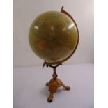 An antique Philips terrestial globe on gilded metal triform stand