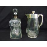 A Victorian glass lemonade jug with silver collar, handle and hinged cover, Birmingham 1889 and an