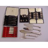 Five cased sets of silver flatware and servers