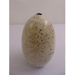 A west country contemporary ceramic egg shaped vase with speckled glaze
