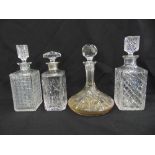 A ships decanter, two hobnail cut lead crystal decanters and Georgian style decanter with silver