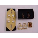 A pair of Gucci cufflinks, a set of four mother-of-pearl dress pins, a pair of rolled gold and