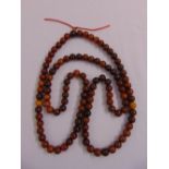 A Chinese necklace of horn beads