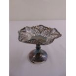 A silver bonbon dish, scroll pierced sides, on raised circular base, Birmingham 1965