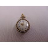 A pendant watch set with diamonds, white enamel dial with Arabic numerals, tested 14ct gold