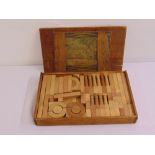 An early 20th century wooden childrens brick building set in original wooden case