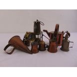 A quantity of brass and copper to include a Davy lamp, a watering can, a funnel and oil cans (8)