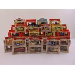 A quantity of Lledo diecast to include cars, vans and carriages all in original packaging as new (