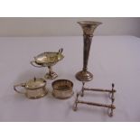 A quantity of silver to include a pair of knife rests, condiments, a vase and a bonbon dish
