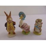 Three Beskwick Beatrix Potter figurines to include Jemina Puddleduck, Miss Moppet and Mr Benjamin