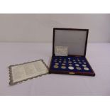 A quantity of American coins in fitted case to include some silver coins and COAs