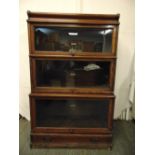 Globe Wernicke three section glazed bookcase with single base drawer section and top plinth