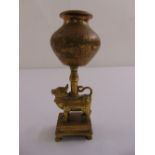 A cast brass Middle Eastern oil lamp in the form of a four legged animal supporting a vase form bowl