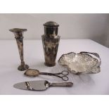 A quantity of silver plate to include a Mappin and Webb cocktail shaker, a pierced fruit basket, and