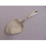 A Liberty & Co silver hand hammered serving slice, with stylised leaf and scroll handle, set with