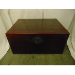 An oriental rectangular hardwood cabinet with brass mounts and lock plate to the single drawer and