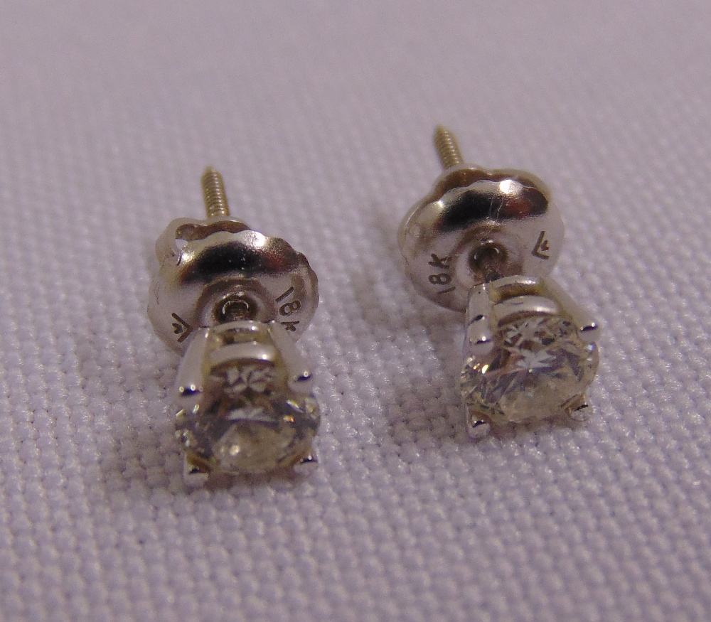 A pair of 18ct white gold and diamond stud earrings, approx total weight 0.9g