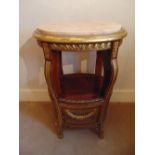 An oval side table with marble inset top and bergere panels to the sides, A/F
