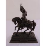 A bronzed figurine depicting Joan of Arc on horseback on raised rectangular plinth