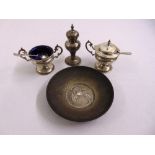 Three piece silver condiment set to include two condiment spoons and a white metal dish
